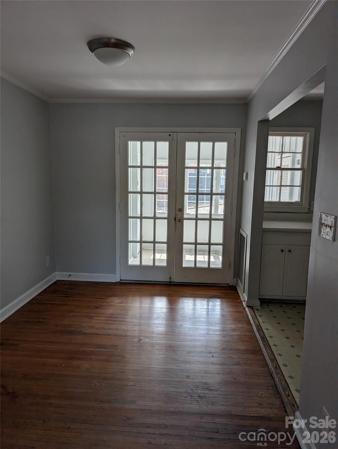 910 McAlway Road, Unit C Charlotte, NC 28211 - Photo 11 of 13 wooden floor in an empty room with a window