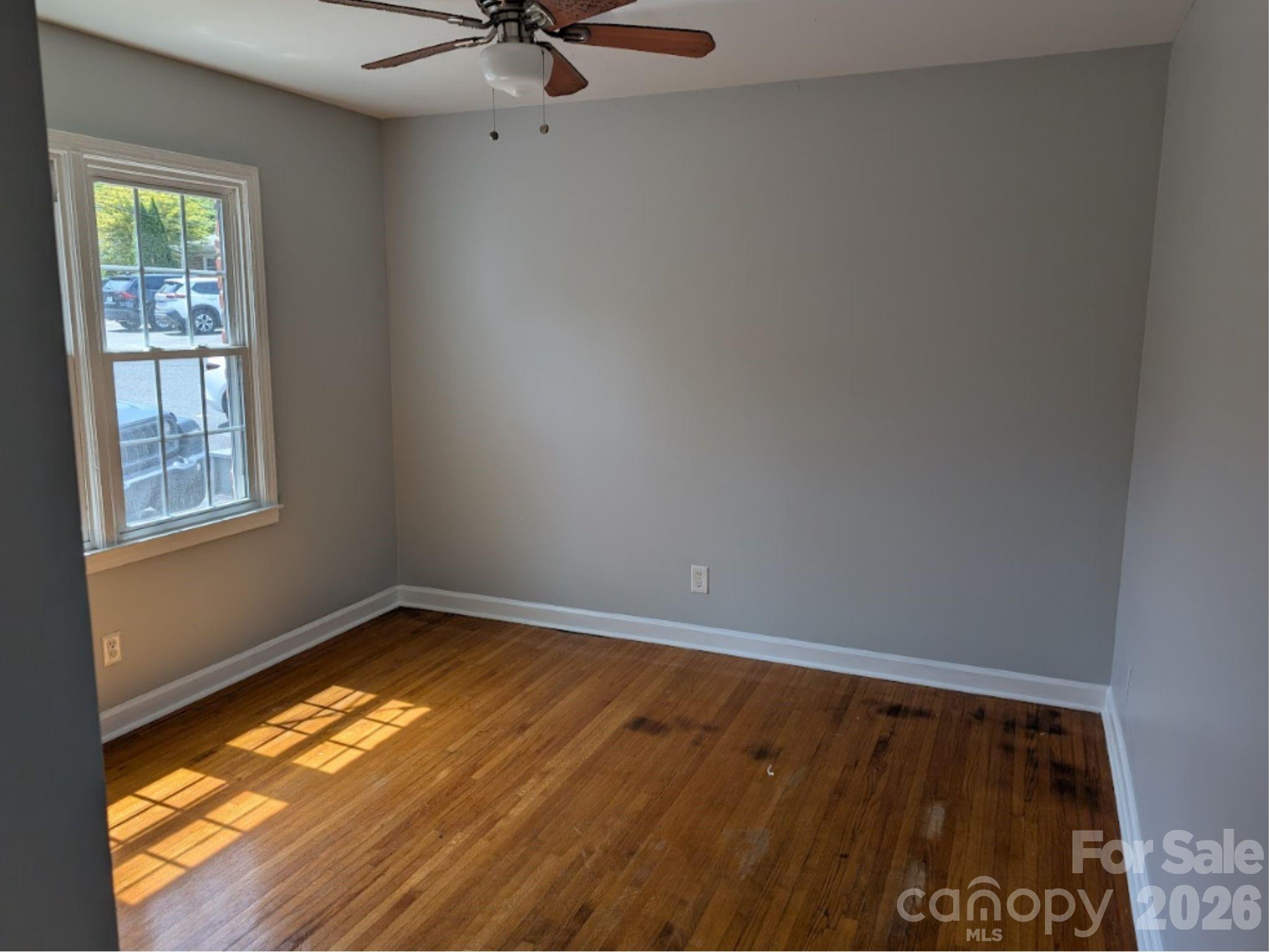 910 McAlway Road, Unit C Charlotte, NC 28211 - Photo 6 of 13 a view of an empty room with a window