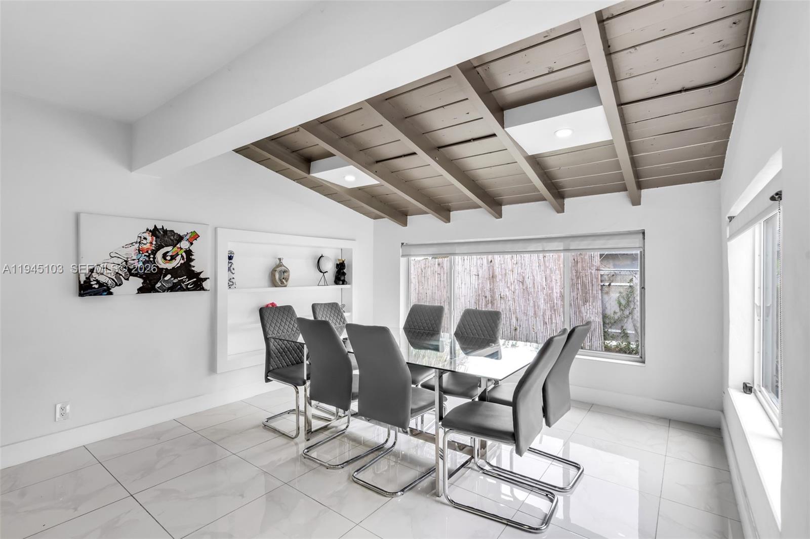 2721 Harding Street Hollywood, FL 33020 - Photo 15 of 38 a dining room with furniture and window
