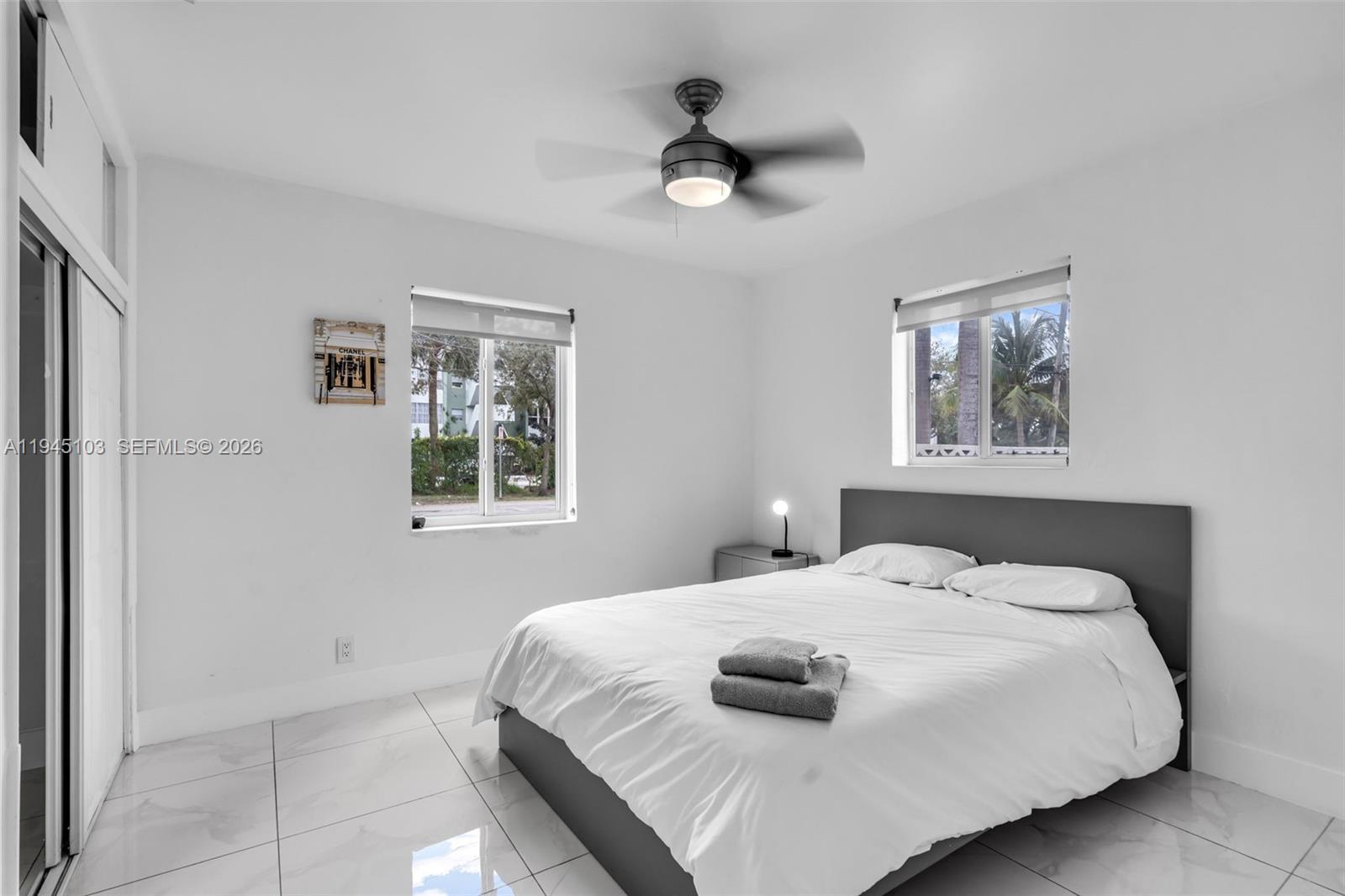 2721 Harding Street Hollywood, FL 33020 - Photo 25 of 38 a bedroom with a bed and a window