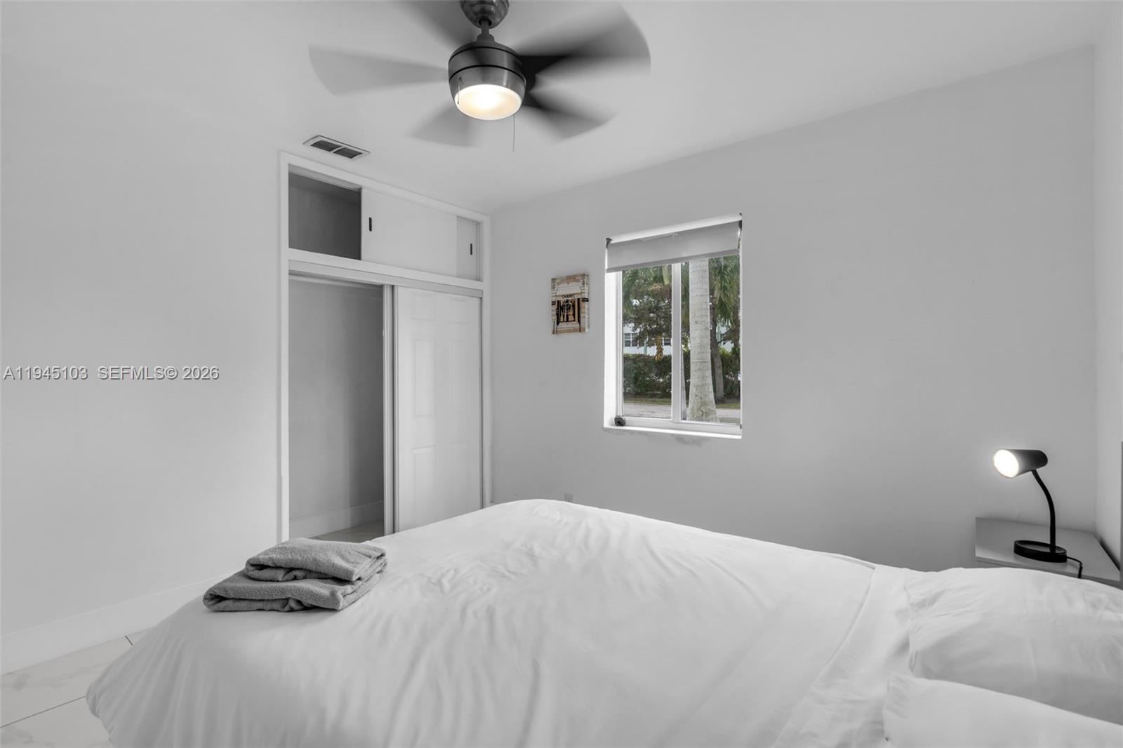 2721 Harding Street Hollywood, FL 33020 - Photo 26 of 38 a bedroom with a bed and a window