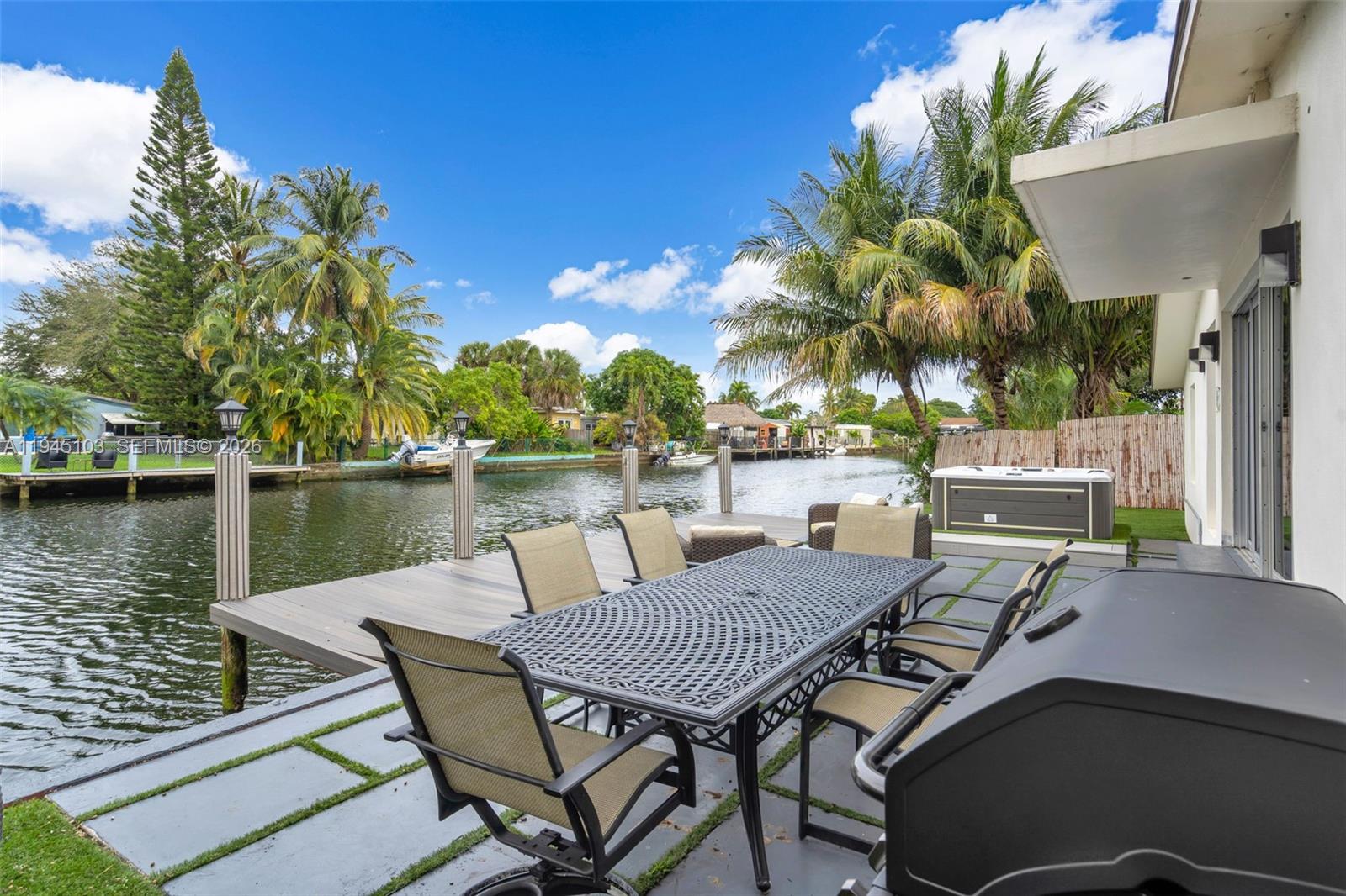 2721 Harding Street Hollywood, FL 33020 - Photo 30 of 38 a view of a lake with table and chairs
