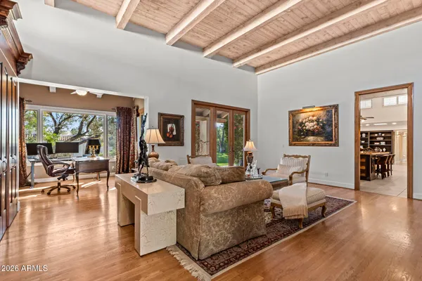 a view of a livingroom with furniture and a window