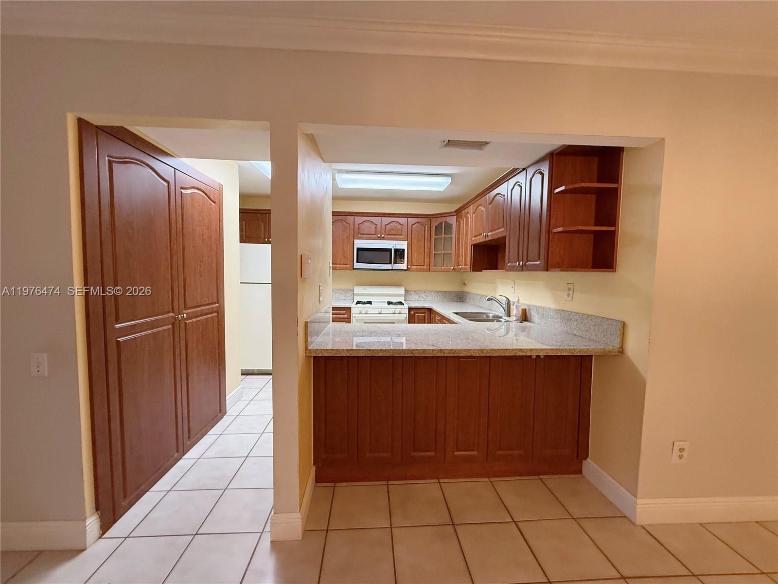 6977 Southwest 115th Place, Unit E33 Miami, FL 33173 - Photo 16 of 32 Kitchen View