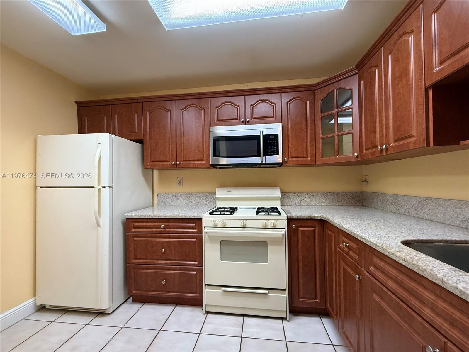 6977 Southwest 115th Place, Unit E33 Miami, FL 33173 - Photo 17 of 32 Kitchen View