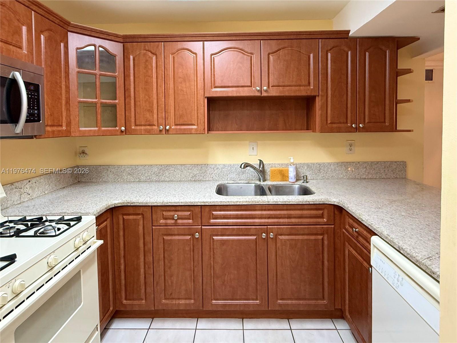 6977 Southwest 115th Place, Unit E33 Miami, FL 33173 - Photo 18 of 32 Kitchen View