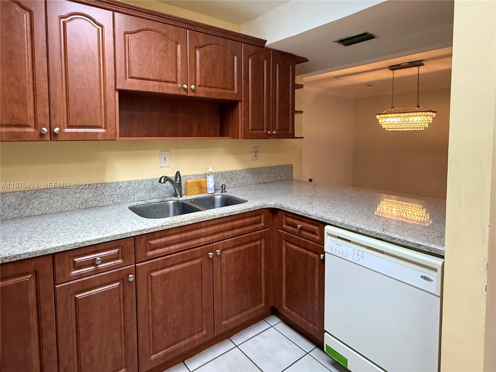 6977 Southwest 115th Place, Unit E33 Miami, FL 33173 - Photo 19 of 32 Kitchen View