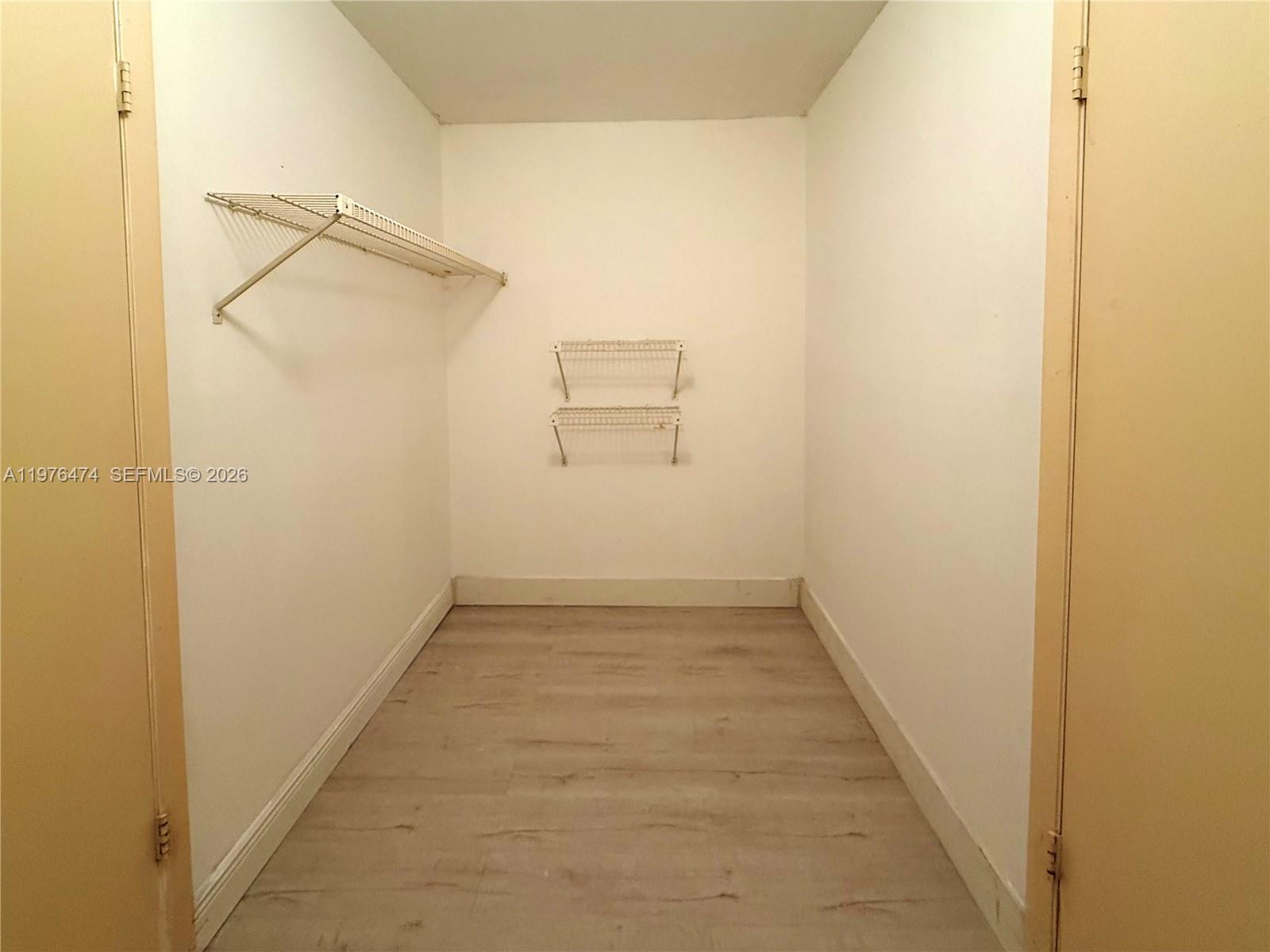 6977 Southwest 115th Place, Unit E33 Miami, FL 33173 - Photo 25 of 32 Bedroom No 3's Walk-In Closet View
