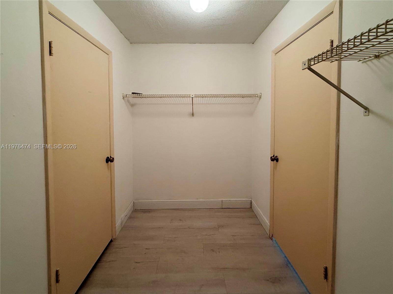 6977 Southwest 115th Place, Unit E33 Miami, FL 33173 - Photo 26 of 32 Bedroom No 3's Walk-In Closet View