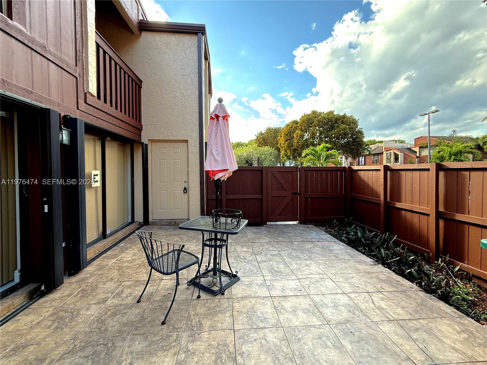 6977 Southwest 115th Place, Unit E33 Miami, FL 33173 - Photo 5 of 32 Front Courtyard View