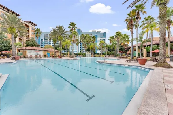 a view of swimming pool with outdoor seating