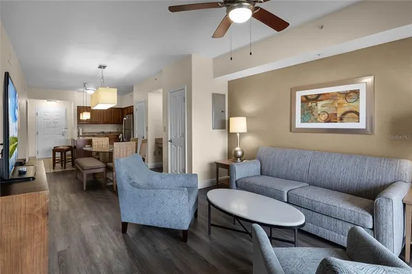 a living room with furniture and a flat screen tv