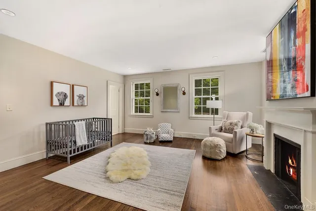 a bedroom with furniture and a fireplace