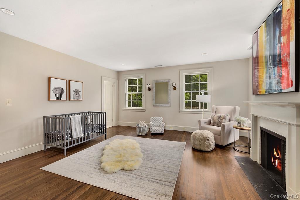 77 Oregon Road Bedford Corners, NY 10549 - Photo 21 of 27 a bedroom with furniture and a fireplace