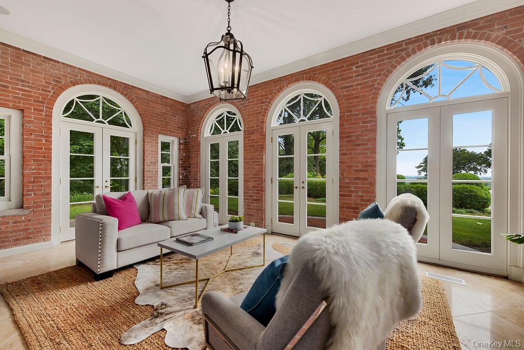 77 Oregon Road Bedford Corners, NY 10549 - Photo 9 of 27 a living room with furniture fireplace and windows