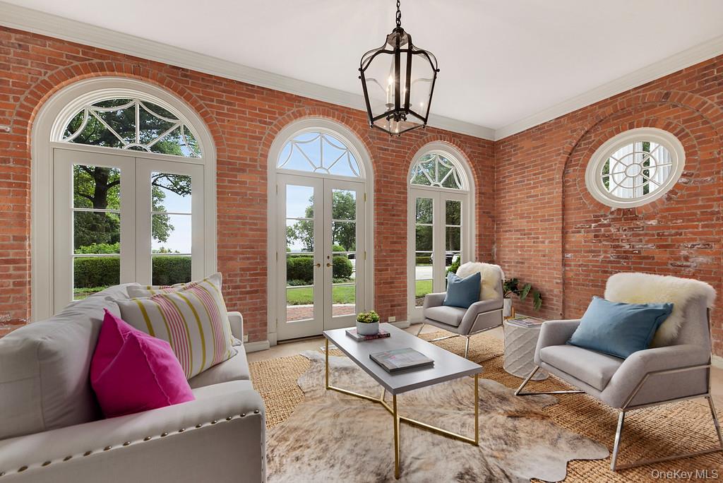 77 Oregon Road Bedford Corners, NY 10549 - Photo 10 of 27 a living room with furniture a table and a large window