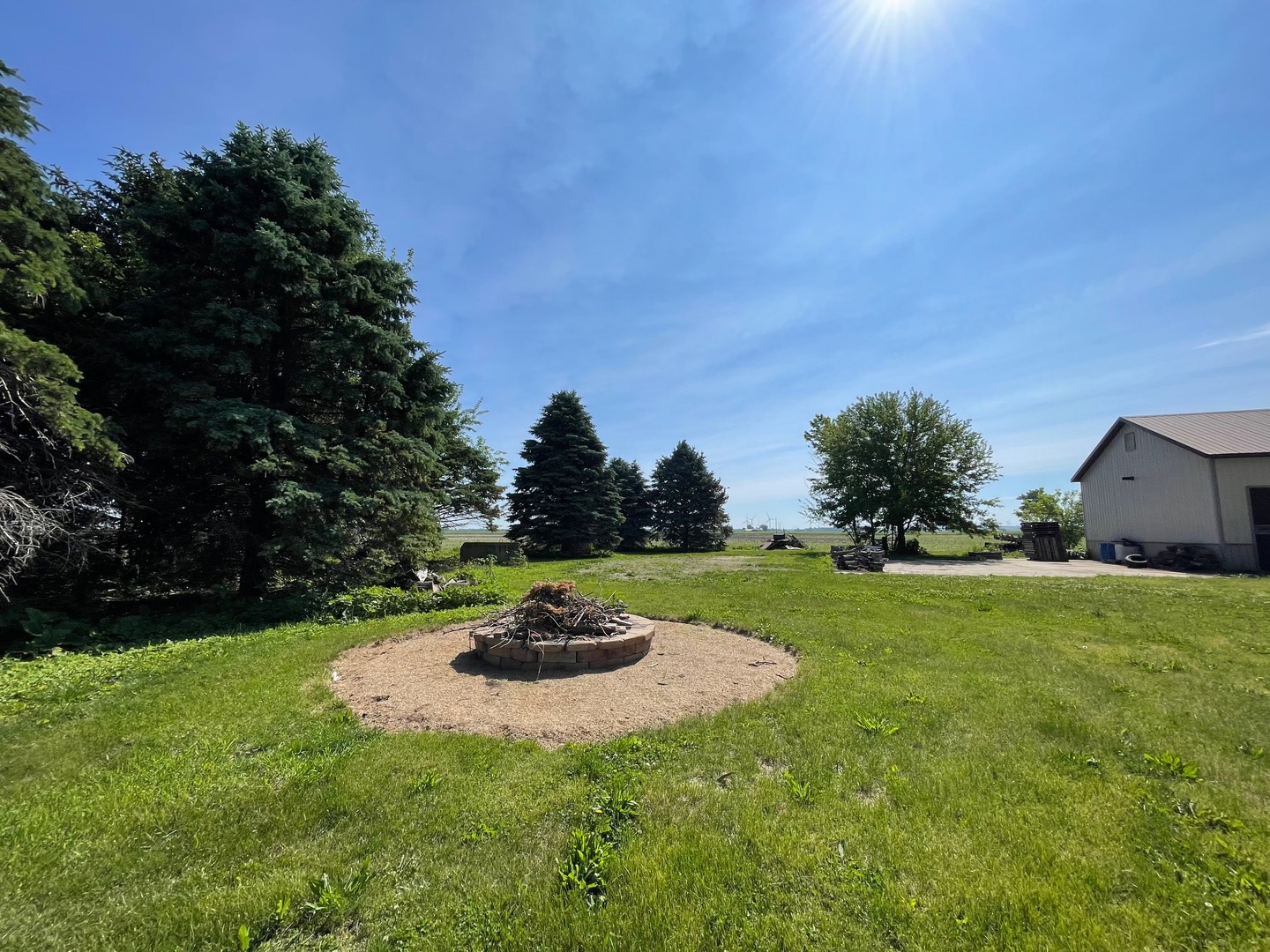 382 Keigwin Road Walnut, IL 61376 - Photo 5 of 49 a view of a big yard with a house