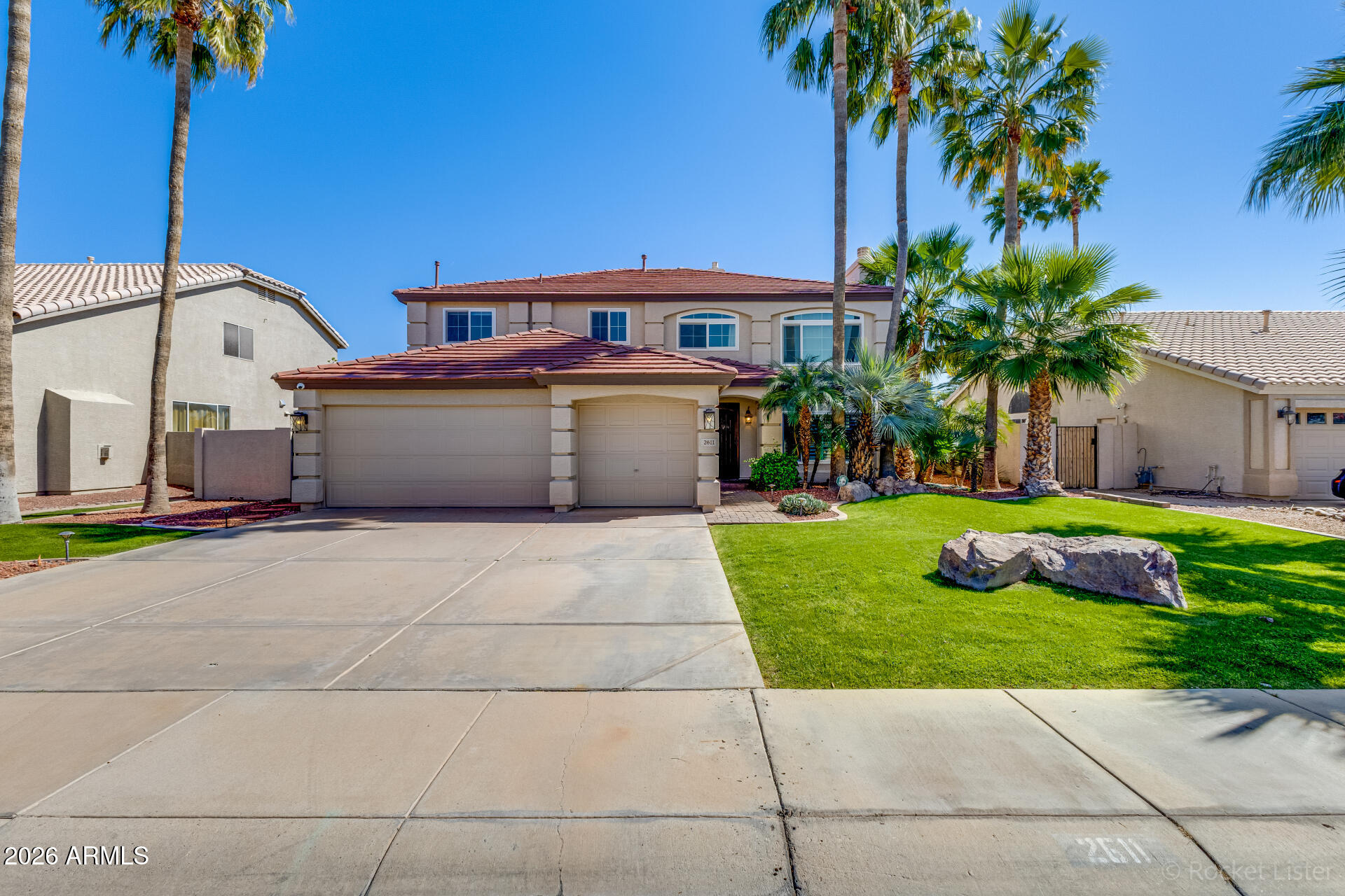 2611 East Catclaw Street Gilbert, AZ 85296 - Photo 1 of 29 a front view of a house with garden