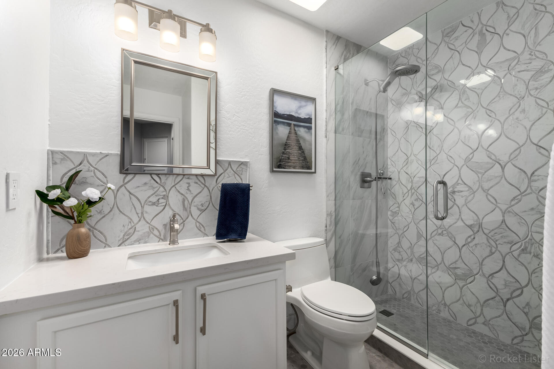 2611 East Catclaw Street Gilbert, AZ 85296 - Photo 11 of 29 a bathroom with a sink a toilet and shower