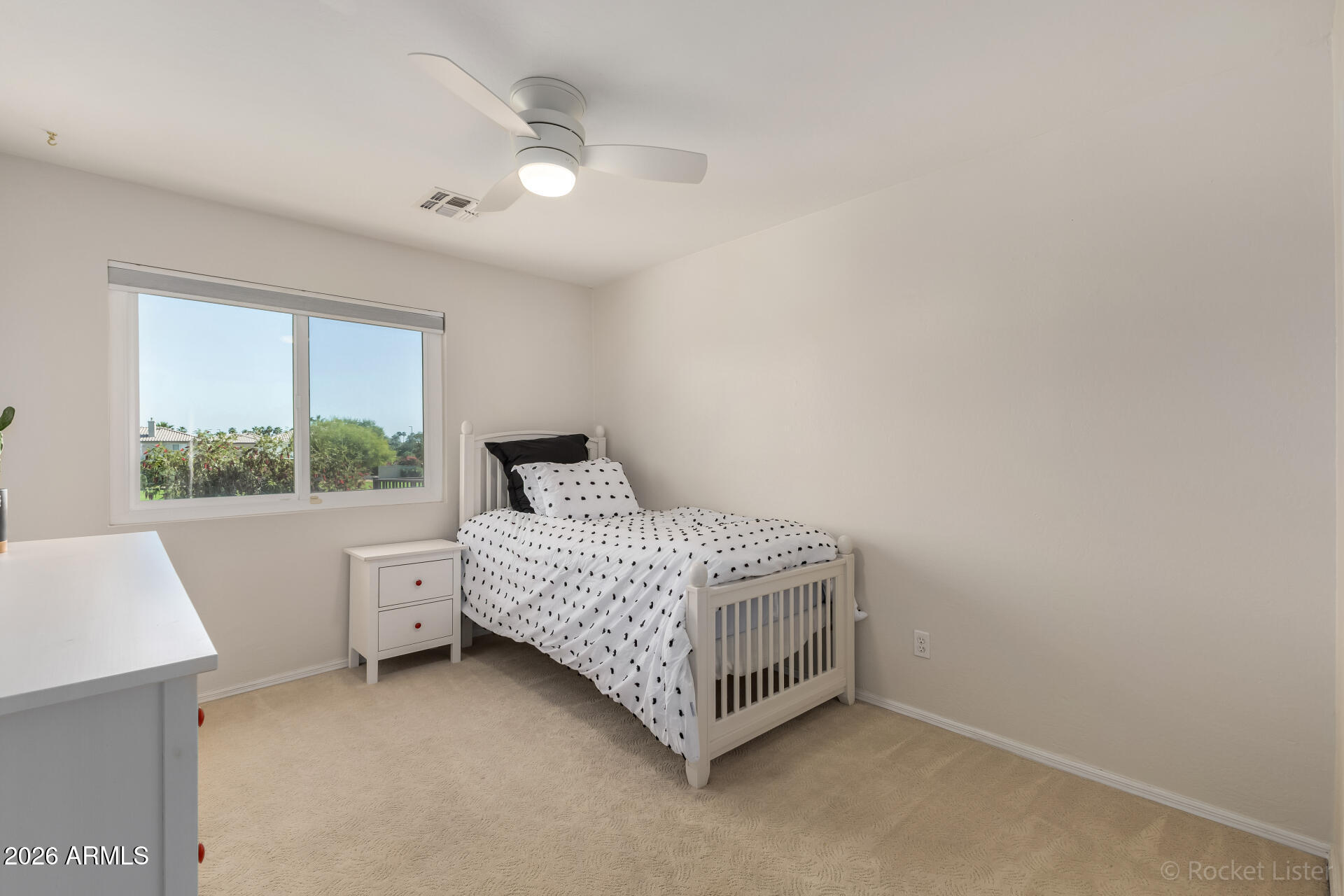 2611 East Catclaw Street Gilbert, AZ 85296 - Photo 21 of 29 a room with a bed and a window