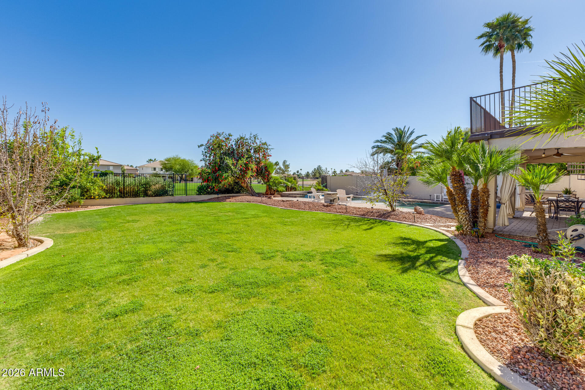 2611 East Catclaw Street Gilbert, AZ 85296 - Photo 24 of 29 a view of a garden with a palm tree