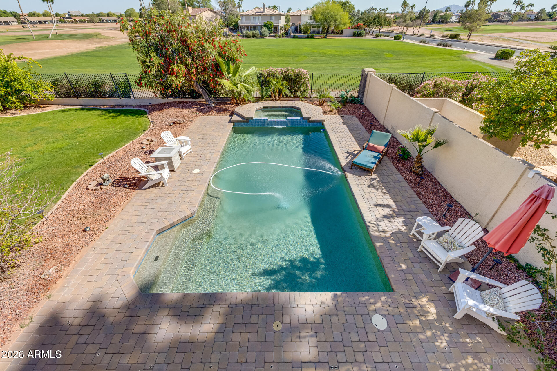 2611 East Catclaw Street Gilbert, AZ 85296 - Photo 26 of 29 a view of yard with swimming pool and green space