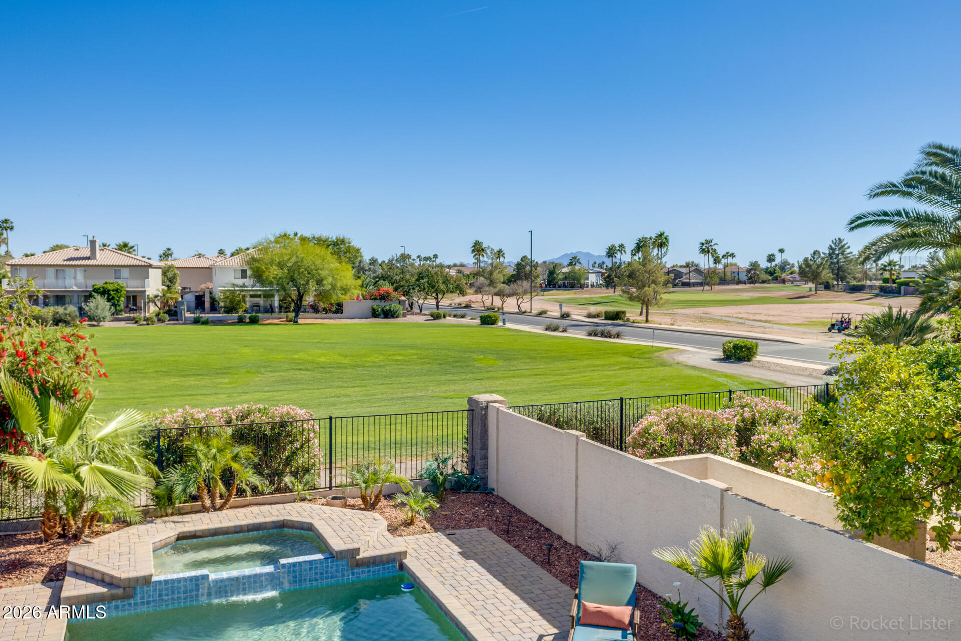 2611 East Catclaw Street Gilbert, AZ 85296 - Photo 27 of 29 a view of a garden with lawn chairs