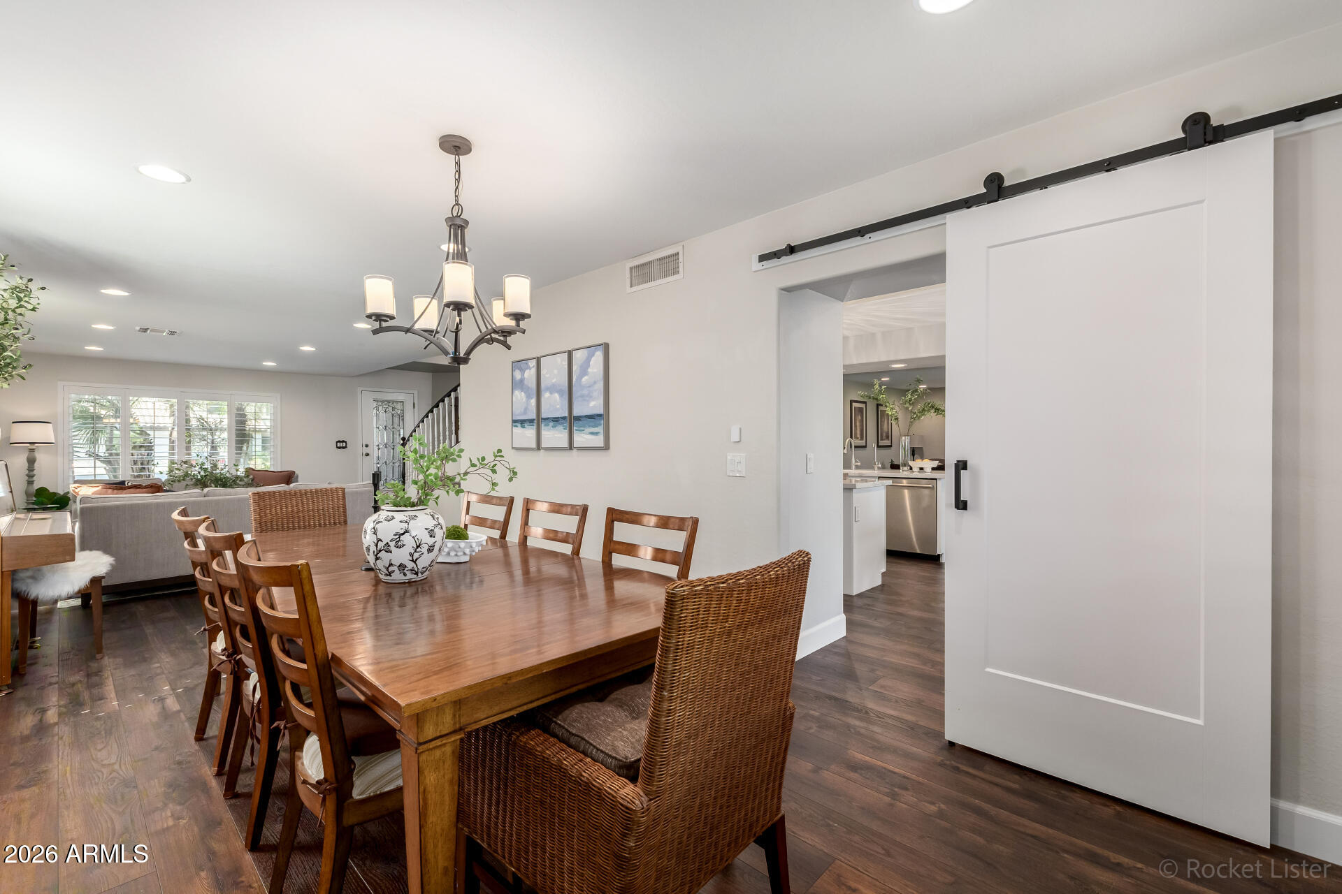 2611 East Catclaw Street Gilbert, AZ 85296 - Photo 5 of 29 a view of a dining room with furniture and wooden floor