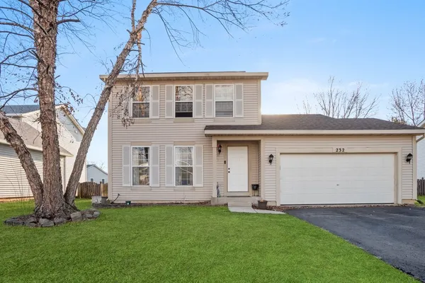 front view of a house with a yard