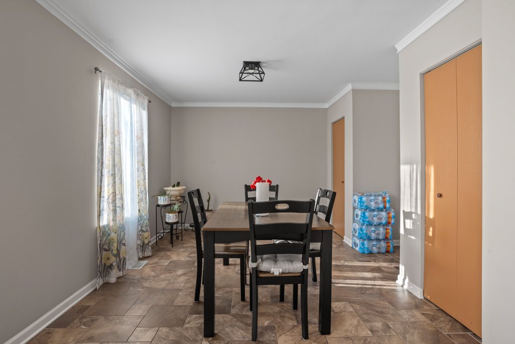 232 Stamford Lane Romeoville, IL 60446 - Photo 13 of 48 a view of a dining room with furniture and a window