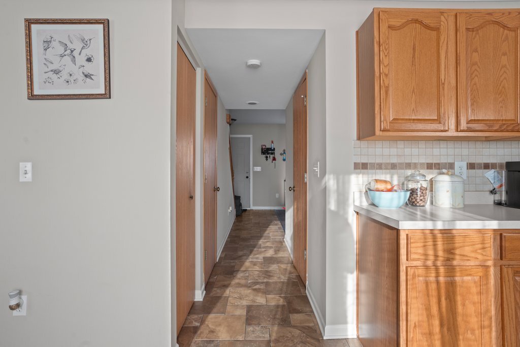 232 Stamford Lane Romeoville, IL 60446 - Photo 16 of 48 a view of a kitchen with fridge and windows