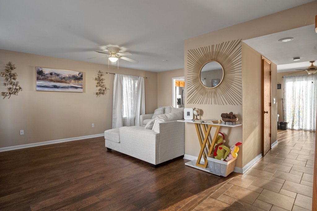 232 Stamford Lane Romeoville, IL 60446 - Photo 17 of 48 a living room with furniture and a window