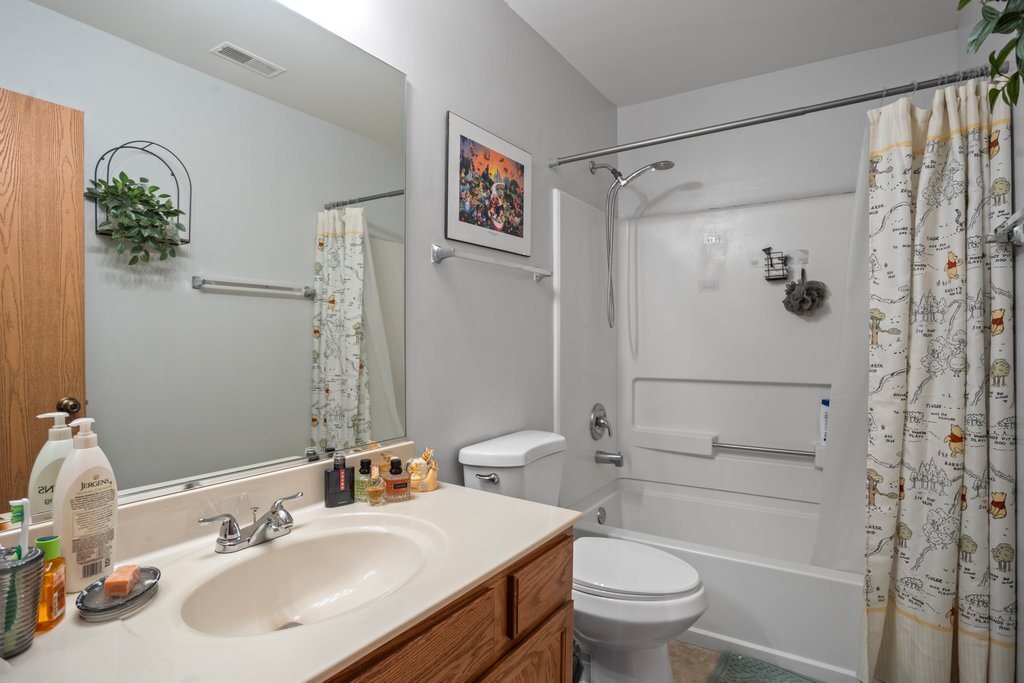 232 Stamford Lane Romeoville, IL 60446 - Photo 20 of 48 a bathroom with a sink toilet and shower