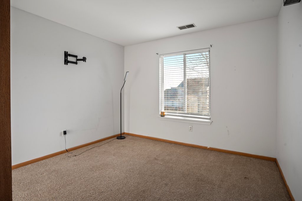232 Stamford Lane Romeoville, IL 60446 - Photo 24 of 48 a view of an empty room with a window