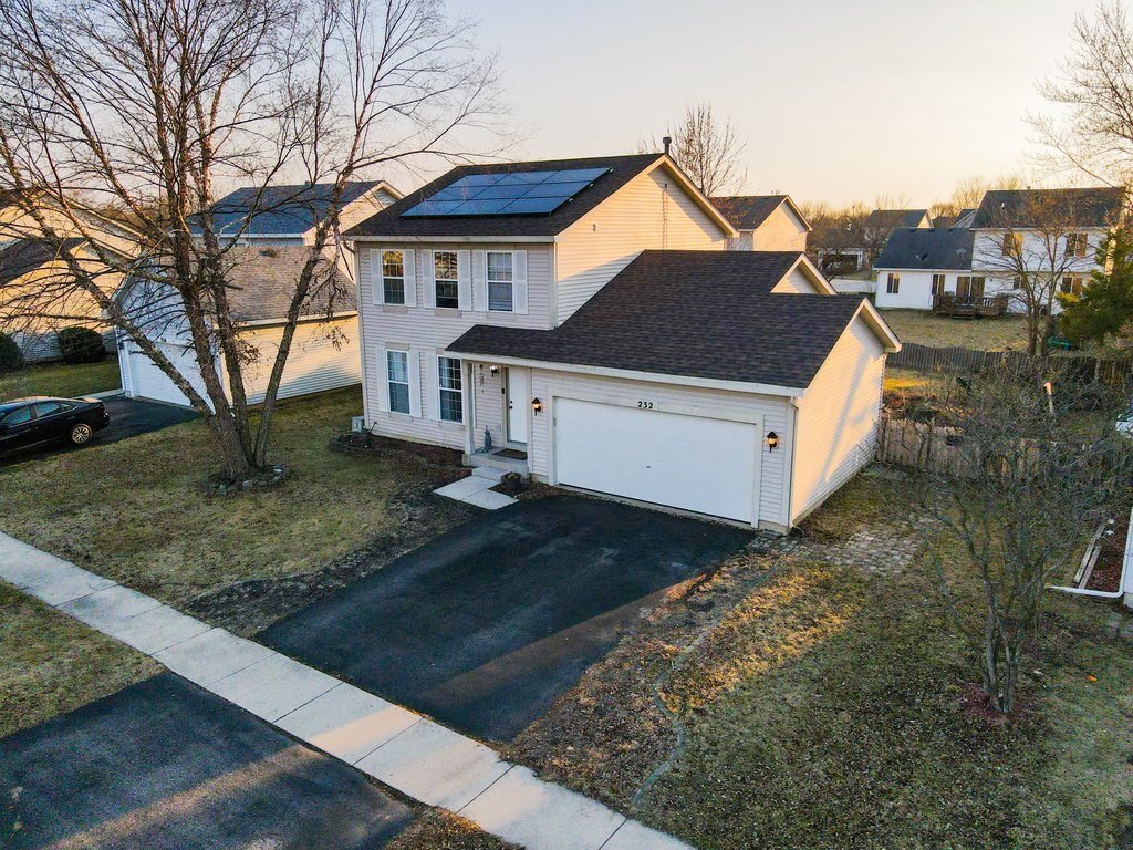 232 Stamford Lane Romeoville, IL 60446 - Photo 28 of 48 a view of a house with a yard