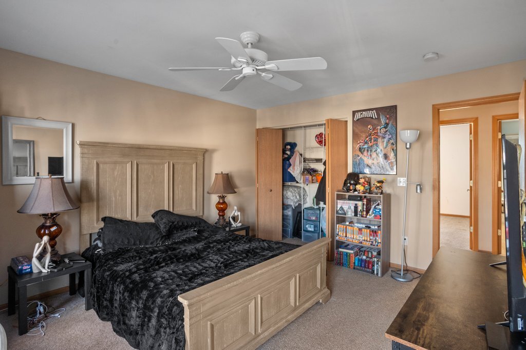 232 Stamford Lane Romeoville, IL 60446 - Photo 29 of 48 a bed room with a bed and a walk in closet