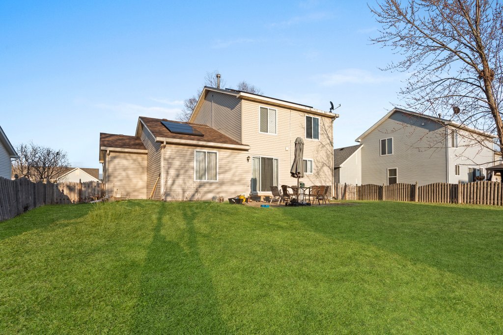 232 Stamford Lane Romeoville, IL 60446 - Photo 35 of 48 a view of a backyard with plants and a garden