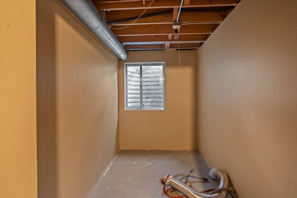 232 Stamford Lane Romeoville, IL 60446 - Photo 42 of 48 a view of room with window and a wooden floor
