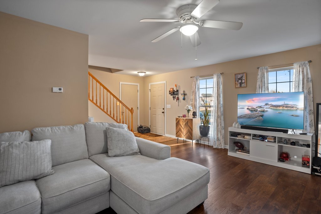 232 Stamford Lane Romeoville, IL 60446 - Photo 43 of 48 a living room with furniture and a flat screen tv