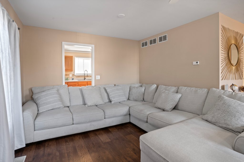 232 Stamford Lane Romeoville, IL 60446 - Photo 44 of 48 a living room with furniture and a large window