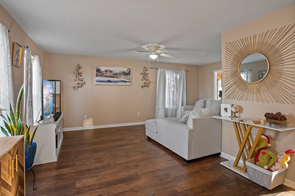 232 Stamford Lane Romeoville, IL 60446 - Photo 45 of 48 a living room with furniture and a flat screen tv