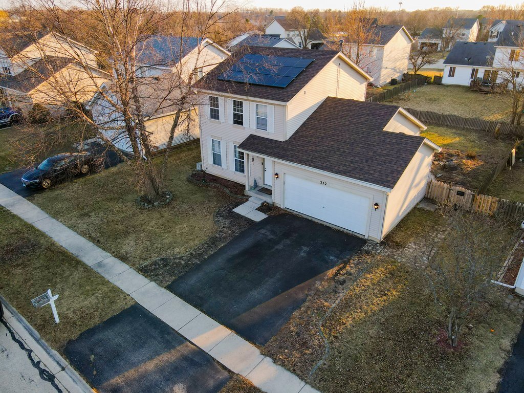 232 Stamford Lane Romeoville, IL 60446 - Photo 46 of 48 a view of a house with a yard