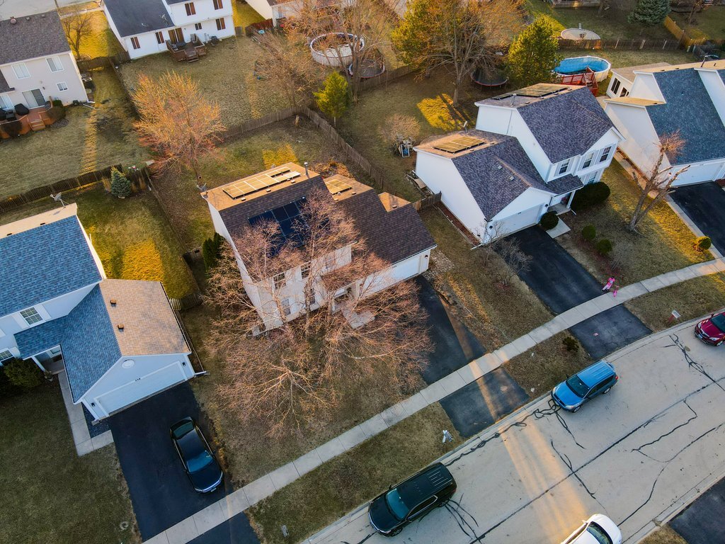 232 Stamford Lane Romeoville, IL 60446 - Photo 48 of 48 an aerial view of a house with a garden