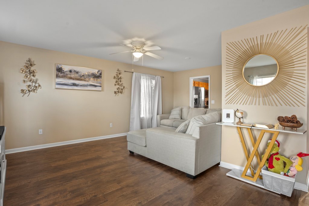 232 Stamford Lane Romeoville, IL 60446 - Photo 5 of 48 a living room with furniture and a table
