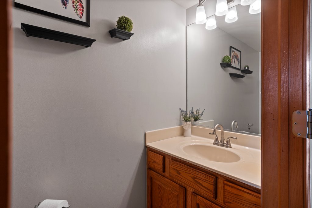 232 Stamford Lane Romeoville, IL 60446 - Photo 7 of 48 a bathroom with a sink and a mirror