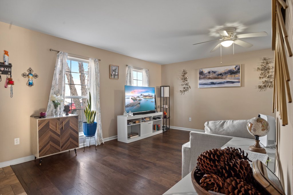 232 Stamford Lane Romeoville, IL 60446 - Photo 9 of 48 a living room with furniture and a flat screen tv