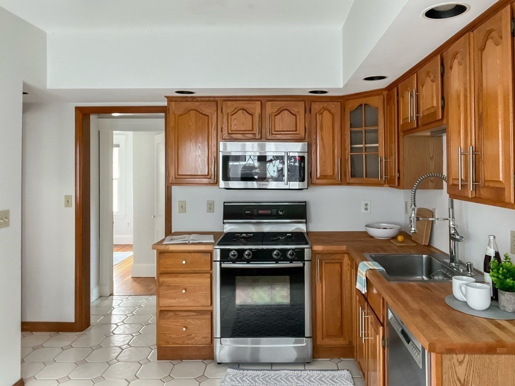 7 Gorham Road Medford, MA 02155 - Photo 13 of 42 a kitchen with a stove and a sink