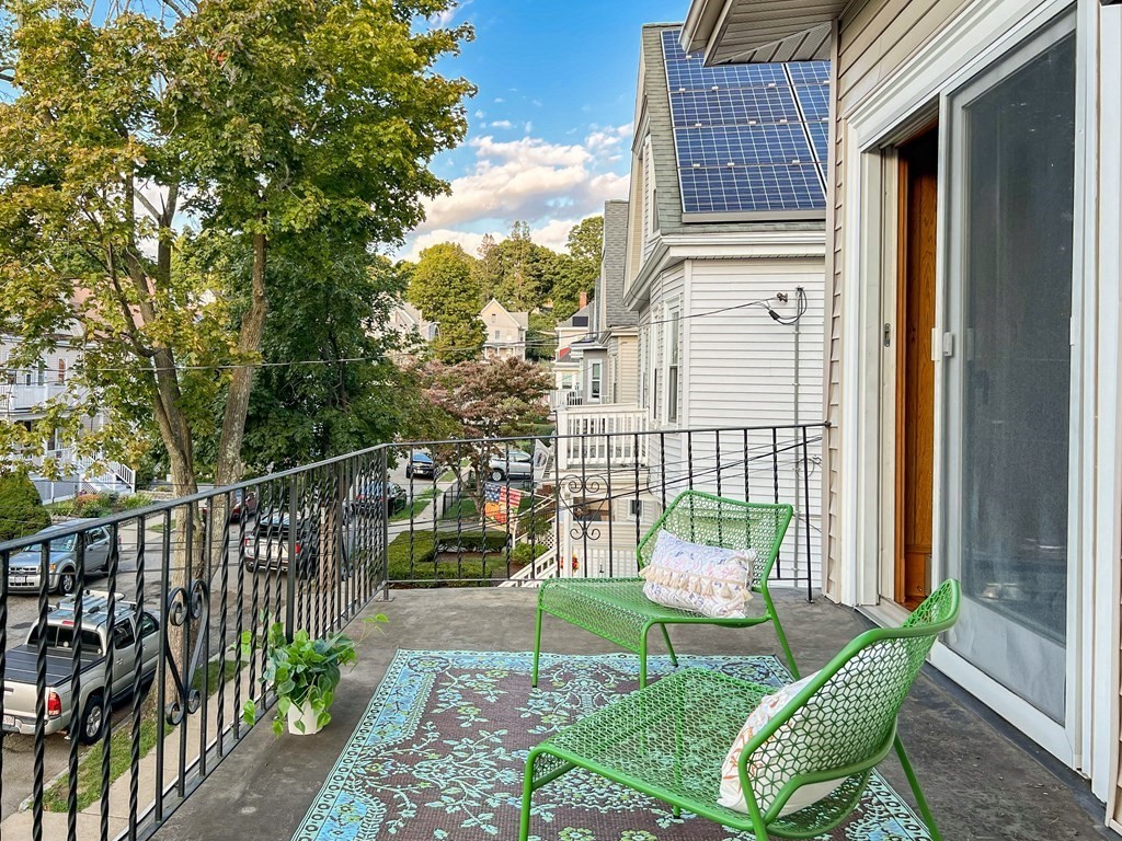 7 Gorham Road Medford, MA 02155 - Photo 21 of 42 a view of a chair and table in the balcony