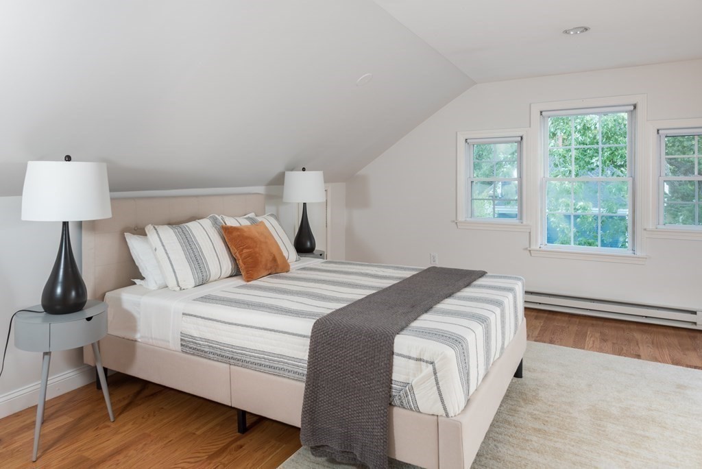7 Gorham Road Medford, MA 02155 - Photo 24 of 42 a bedroom with a bed and a lamp