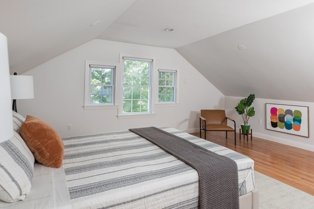 7 Gorham Road Medford, MA 02155 - Photo 25 of 42 a bedroom with a bed and a dresser next to a window